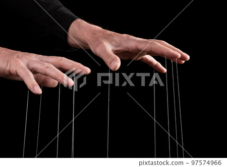 Hand manipulating and controlling smth with strings concept Hand manipulating and controlling smth with strings concept 97574966