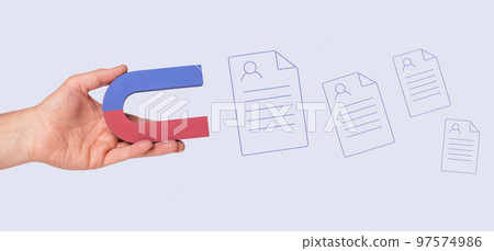 Human resources. Hand with magnet attracting CVs. HR manager searching for potential job seekers, talented workers. Headhunter. Demand for good specialists. Human resources. Hand with magnet attracting CVs. HR manager searching for potential job seekers, talented workers. Headhunter. Demand for good specialists. 97574986