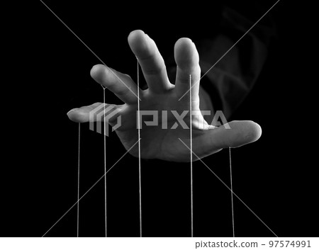 Man hand with strings on fingers. Manipulation, power concept. Male making person feel fear, obligation, guilt. Black and white 97574991