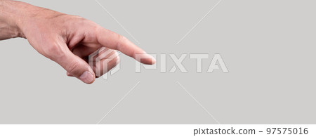 Banner with woman hand with forefinger pointing to object on grey background. Copy space Banner with woman hand with forefinger pointing to object on grey background. Copy space 97575016