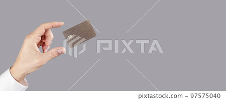 Hand and levitating credit card mockup on gray banner, background Hand and levitating credit card mockup on gray banner, background 97575040