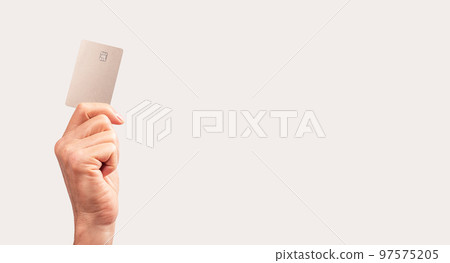 Banner with hand holding credit card mockup with chip. Contactless transactions, secure payments concept. Place for text 97575205