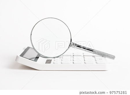 Magnifying glass with calculator. Statistics, financial data analysis concept. Accountant job 97575281