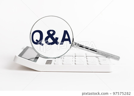 Calculator and magnifying glass with qa abbreviation. Search for answers to questions in business, statistics, finance field. 97575282