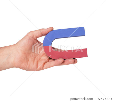 Man hand holding horseshoe magnet isolated on white background Man hand holding horseshoe magnet isolated on white background 97575283
