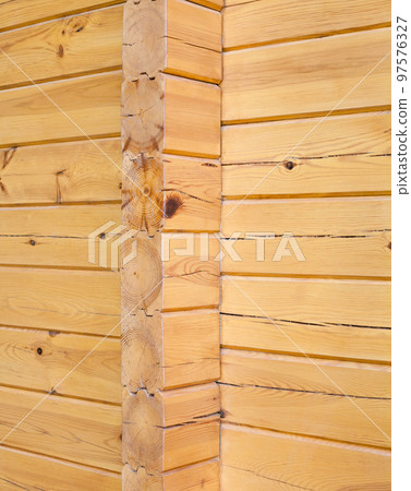 Wooden wall of a log house Wooden wall of a log house 97576327