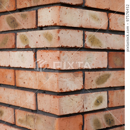 The corner of the brick building 97576452