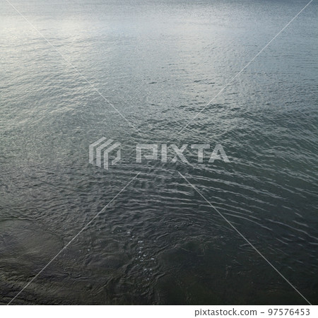 Water surface with ripples Water surface with ripples 97576453
