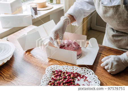 Valentines Day Marketing Ideas for Small Businesses. Confectioner chef make heart shape pink Mirror Glaze mousse cake 97576751