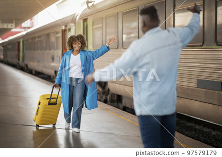 Happy Young Black Couple Meeting At Railway Station After Arrival 97579179