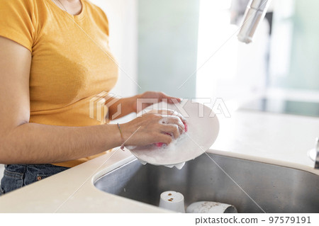 Household Duties. Unrecognizable Young Woman Washing Dishes In Kitchen At Home, Cropped 97579191