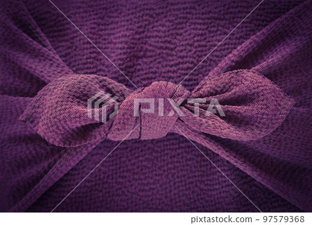 Furoshiki wrapping for gifts, tied purple furoshiki 97579368