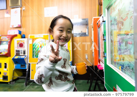 Elementary school students playing at a candy store 97579799