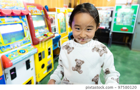 Elementary school students playing at a candy store 97580120