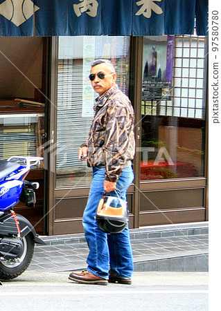 Senior man shopping at a tourist spot 97580780