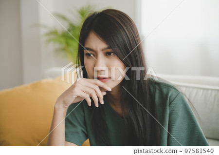 Upset asian woman frustrated by problem with work or relationships 97581540