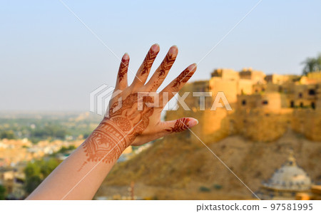 Henna tattoo on woman hands Henna tattoo on woman hands 97581995
