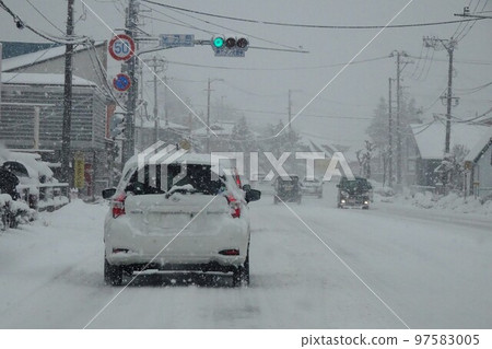 General road in snow View from a passenger car 97583005