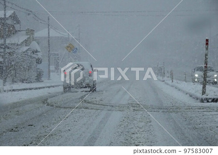 General road in snow General road with poor visibility due to snowfall 97583007