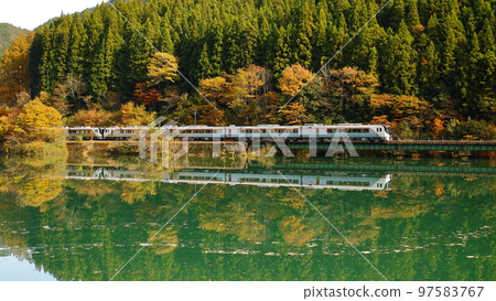 HC85 Series Limited Express Hida running through Shimohara Dam in late autumn (16:9) 97583767
