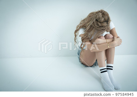 Crying blonde woman break down in tears 97584945