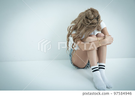 Crying blonde woman break down in tears 97584946