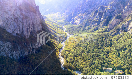 Mountain river valley from above 97585383