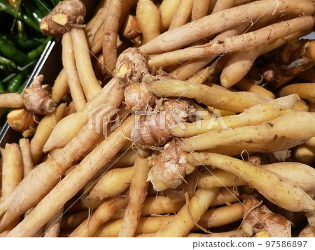 Chinese ginger or galingale rhizome at the market. Chinese ginger or galingale rhizome at the market. 97586897