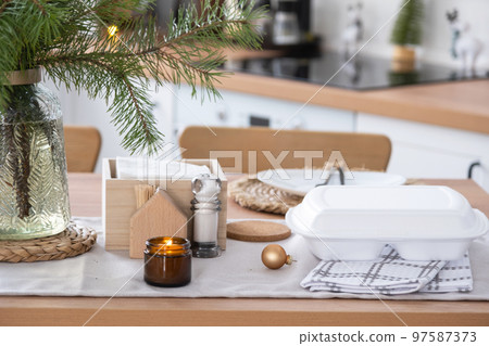 Food delivery service containers on table in white kitchen, festively served for celebration of Christmas and new year. Saving time, hot order, disposable plastic box, craft package. mock up Food delivery service containers on table in white kitchen, festively served for celebration of Christmas and new year. Saving time, hot order, disposable plastic box, craft package. mock up 97587373