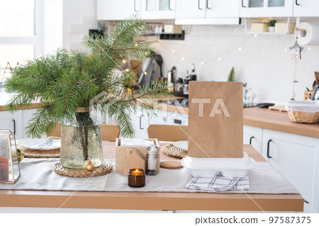 Food delivery service containers on table in white kitchen, festively served for celebration of Christmas and new year. Saving time, hot order, disposable plastic box, craft package. mock up Food delivery service containers on table in white kitchen, festively served for celebration of Christmas and new year. Saving time, hot order, disposable plastic box, craft package. mock up 97587375