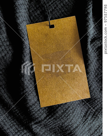 Blank fashion label tag, sale price card on luxury fabric background, shopping and retail concept 97587798