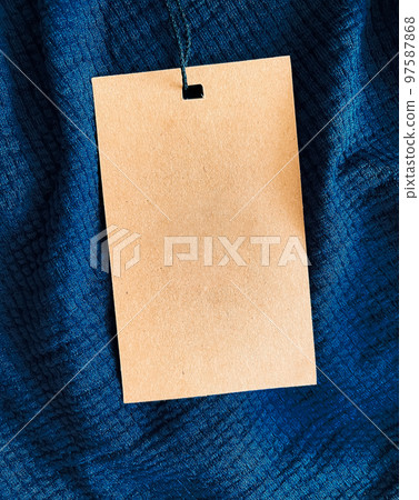 Blank fashion label tag, sale price card on luxury fabric background, shopping and retail concept 97587868