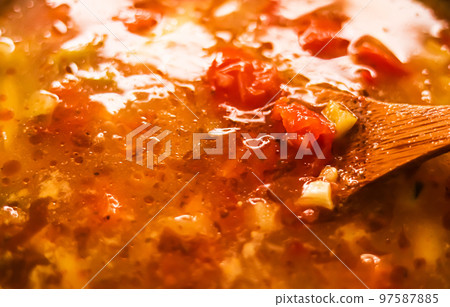 Cooking vegetable soup in saucepan, comfort food and homemade meal concept Cooking vegetable soup in saucepan, comfort food and homemade meal concept 97587885