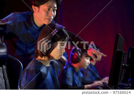 Image of e-sports tournament team competition Director giving advice 97588024