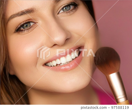 Beautiful young woman applying cosmetic powder product with make-up bamboo brush, beauty, makeup and skincare cosmetics model face portrait on pink background, closeup 97588119