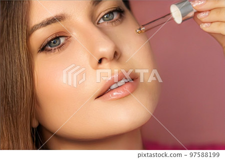 Beauty, makeup and skincare cosmetics model face portrait, woman applying skin care cosmetic product with dropper pipette, luxury facial care mockup 97588199
