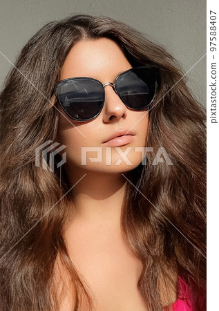 Beautiful stylish woman wearing chic sunglasses, fashionable beauty and feminine style portrait, fashion accessory and classy glamour look concept Beautiful stylish woman wearing chic sunglasses, fashionable beauty and feminine style portrait, fashion accessory and classy glamour look concept 97588407
