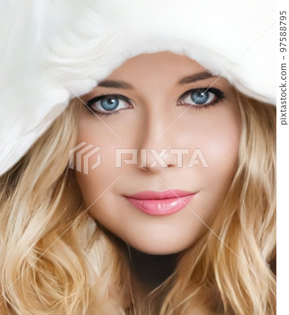 Beautiful woman in white fur coat, beauty and winter fashion. Beautiful woman in white fur coat, beauty and winter fashion. 97588795