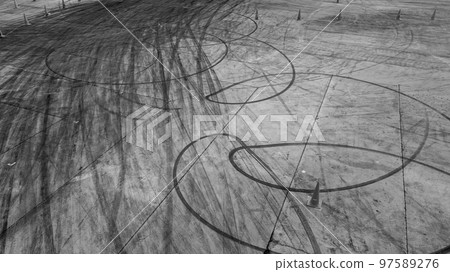 Tire tracks texture and background, Asphalt texture with line and tire marks, Automobile automotive tire skid mark on race track, Abstract texture car drift tire skid mark. Tire tracks texture and background, Asphalt texture with line and tire marks, Automobile automotive tire skid mark on race track, Abstract texture car drift tire skid mark. 97589276
