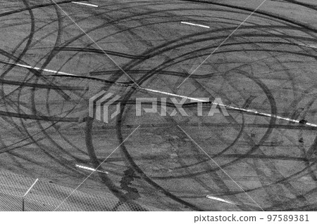 Top view tire tracks texture and background, Asphalt texture with line and tire marks, Automobile automotive tire skid mark on race track, Abstract texture car drift tire skid mark. 97589381