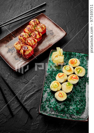 Baked uramaki with salmon and makizushi with cheese hat for two Baked uramaki with salmon and makizushi with cheese hat for two 97589551