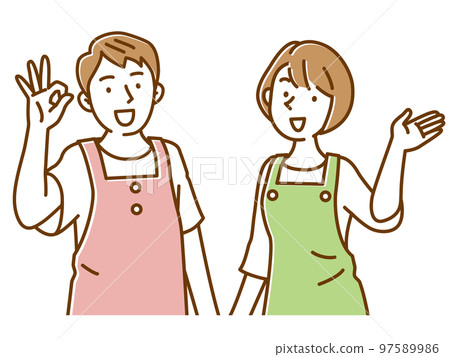 一組兩個穿著圍裙的年輕男女微笑著引導 97589986