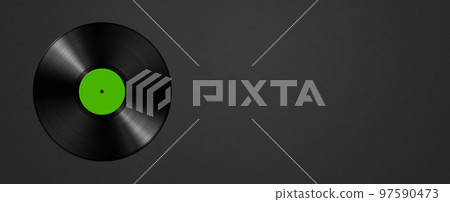 Green vinyl record isolated on black background. Horizontal banner 97590473