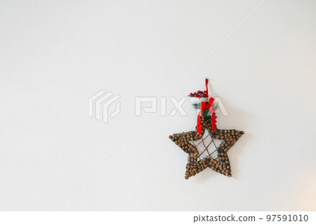 Homemade Christmas star wreath on white background with copy space 97591010