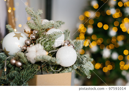 Christmas composition of fir branches, Christmas balls and cotton bolls. Selective focus. Copy space. 97591014