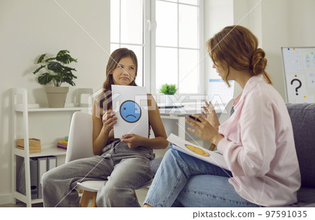Teenage girl describes negative emotions she feels during conversation with school psychologist. 97591035