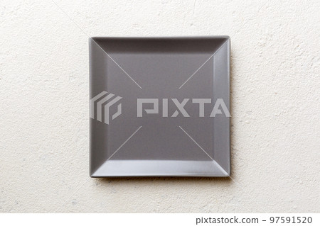 Top view of empty square plate on cement background. Empty space for your design Top view of empty square plate on cement background. Empty space for your design 97591520
