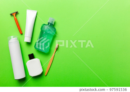 Composition with bath cosmetics on table. razor, toothpaste, soap, gel, toothbrush, mouthwash and other various accessories. Cosmetics for skin health. Bath Mockup for your logo 97591536