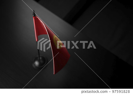 Small national flag of the Kirghizia on a black background Small national flag of the Kirghizia on a black background 97591828