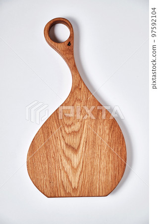 Handmade oak chopping board on white background Handmade oak chopping board on white background 97592104